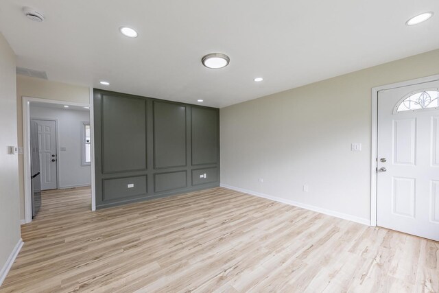 16228 Sussex Ave, Markham, IL 60428 - unfurnished living room with light wood-style flooring, baseboards, and recessed lighting