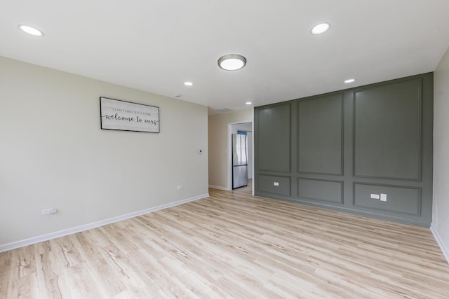 16228 Sussex Ave, Markham, IL 60428 - spare room featuring light wood finished floors, baseboards, and recessed lighting