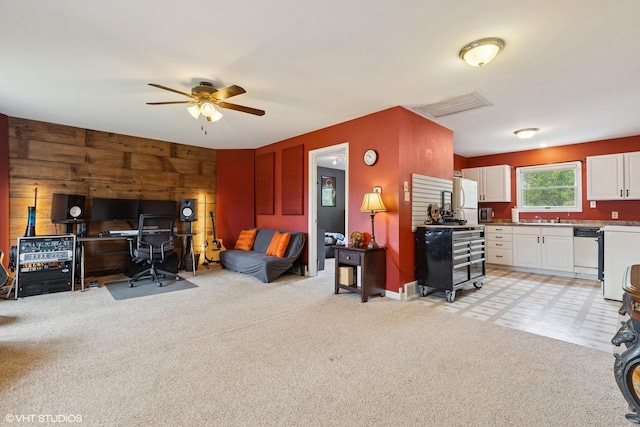 1511 Lakeland Ave, Mchenry, IL 60050 - living room featuring wood walls, light carpet, and ceiling fan