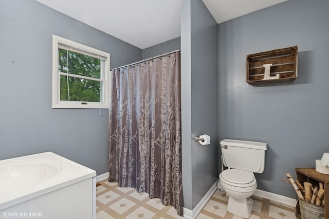 1511 Lakeland Ave, Mchenry, IL 60050 - bathroom with tile patterned floors, toilet, vanity, baseboards, and a shower with curtain