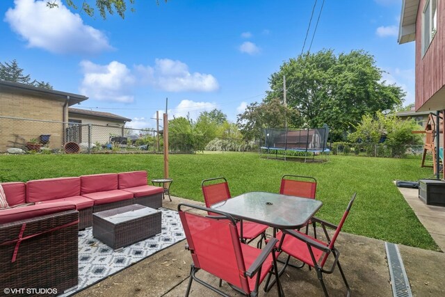 1511 Lakeland Ave, Mchenry, IL 60050 - view of patio featuring a trampoline, outdoor lounge area, and outdoor dining area
