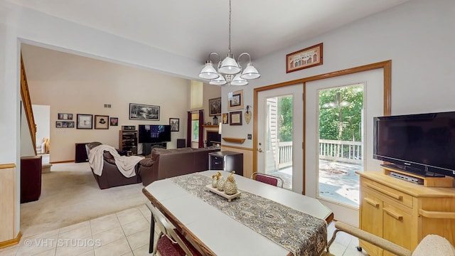 1031 S Wellington Rd, Waukegan, IL 60085 - dining room featuring light colored carpet, a chandelier, and light tile patterned floors