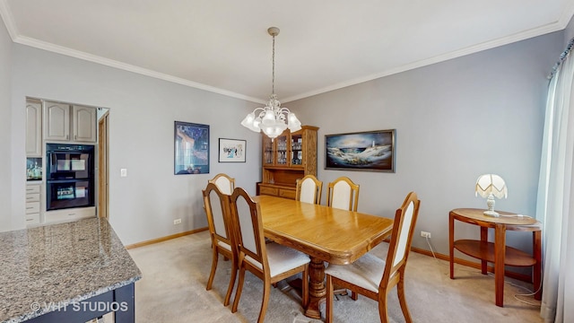 1031 S Wellington Rd, Waukegan, IL 60085 - dining space featuring baseboards, light colored carpet, a chandelier, and crown molding