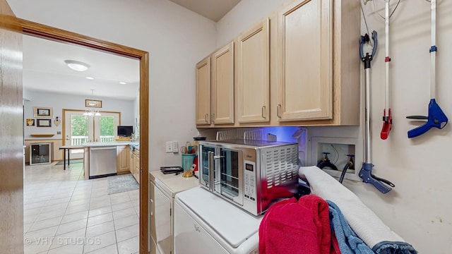 1031 S Wellington Rd, Waukegan, IL 60085 - laundry room featuring cabinet space, independent washer and dryer, and light tile patterned floors