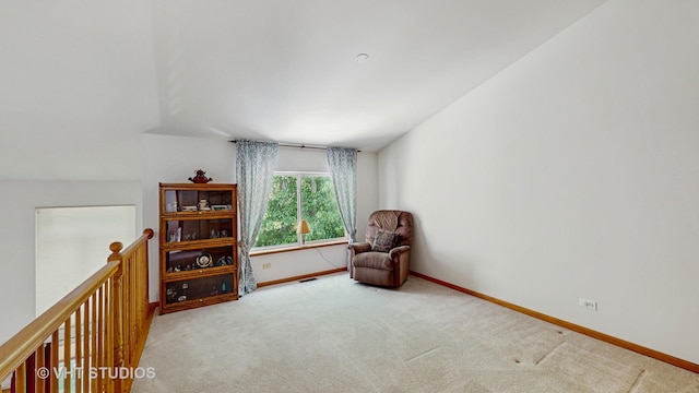 1031 S Wellington Rd, Waukegan, IL 60085 - sitting room with carpet floors, baseboards, and an upstairs landing