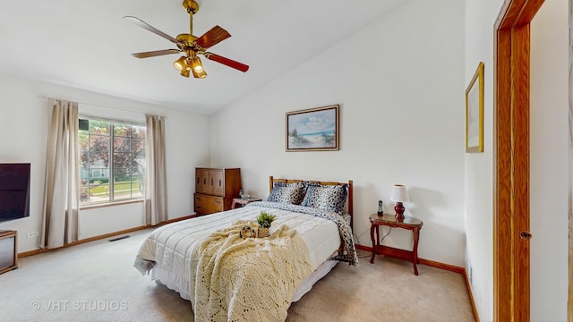 1031 S Wellington Rd, Waukegan, IL 60085 - carpeted bedroom featuring lofted ceiling, baseboards, and a ceiling fan