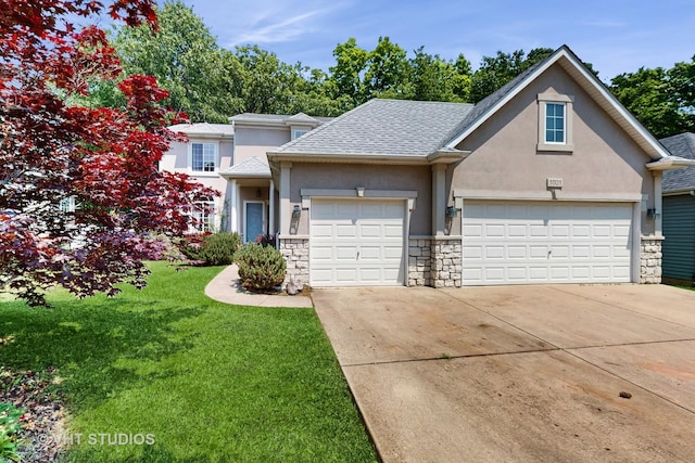 1031 S Wellington Rd, Waukegan, IL 60085 - traditional-style house featuring stucco siding, stone siding, driveway, and a garage
