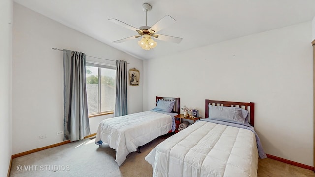 1031 S Wellington Rd, Waukegan, IL 60085 - carpeted bedroom featuring baseboards, vaulted ceiling, and a ceiling fan