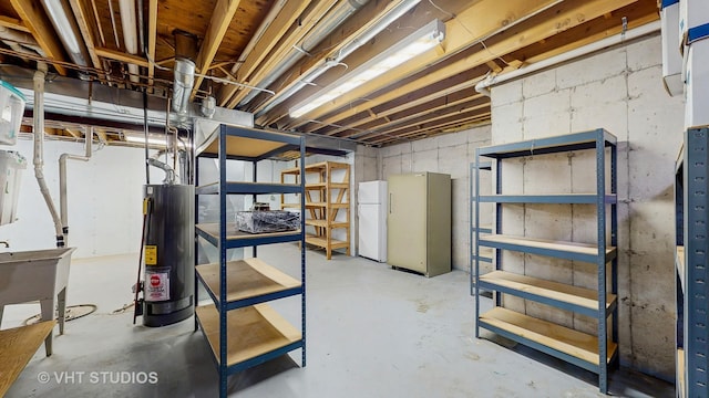1031 S Wellington Rd, Waukegan, IL 60085 - unfinished below grade area with water heater and freestanding refrigerator