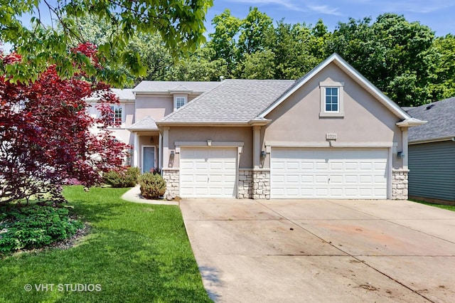 1031 S Wellington Rd, Waukegan, IL 60085 - traditional-style house featuring stucco siding, stone siding, a garage, and driveway