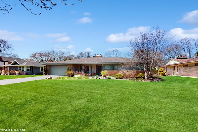7421 N Crossway Rd, Fox Point, WI 53217 - ranch-style home featuring concrete driveway, a chimney, a garage, and a front lawn