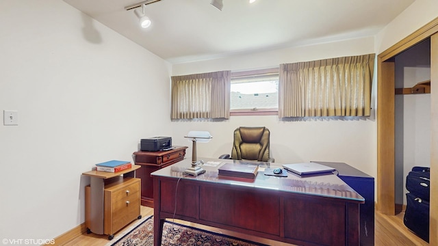 7421 N Crossway Rd, Fox Point, WI 53217 - home office featuring rail lighting and wood finished floors