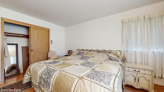 7421 N Crossway Rd, Fox Point, WI 53217 - bedroom with wood finished floors and a closet