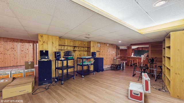 7421 N Crossway Rd, Fox Point, WI 53217 - misc room featuring wooden walls, wood finished floors, and a paneled ceiling