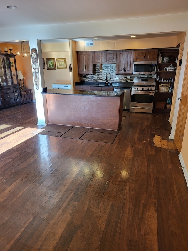 7804 Woodward Ave, Woodridge, IL 60517 - kitchen with stainless steel appliances, dark countertops, dark wood-style flooring, tasteful backsplash, and dark brown cabinets