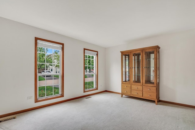 1328 Sunrise Ln, Gurnee, IL 60031 - unfurnished room featuring light carpet and baseboards