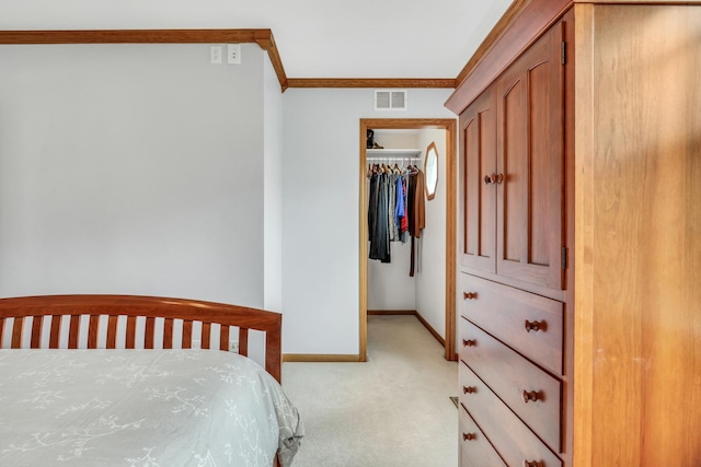 1328 Sunrise Ln, Gurnee, IL 60031 - bedroom featuring ornamental molding, light colored carpet, a walk in closet, baseboards, and a closet