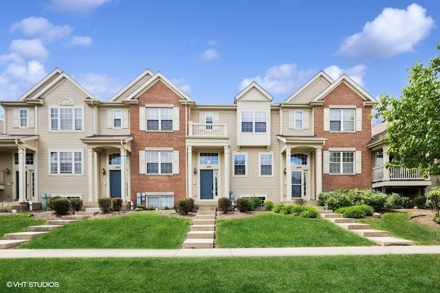 897 Clover Ln, Pingree Grove, IL 60140 - view of property featuring brick siding and a front lawn