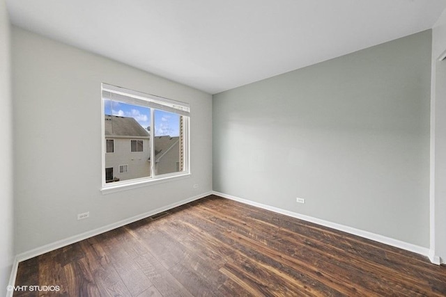 897 Clover Ln, Pingree Grove, IL 60140 - empty room with baseboards and dark wood-style flooring