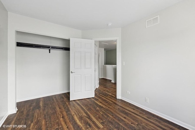 897 Clover Ln, Pingree Grove, IL 60140 - unfurnished bedroom with wood finished floors, a closet, and baseboards