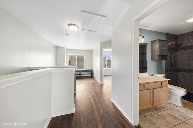 897 Clover Ln, Pingree Grove, IL 60140 - hallway with wood finished floors, an upstairs landing, and attic access