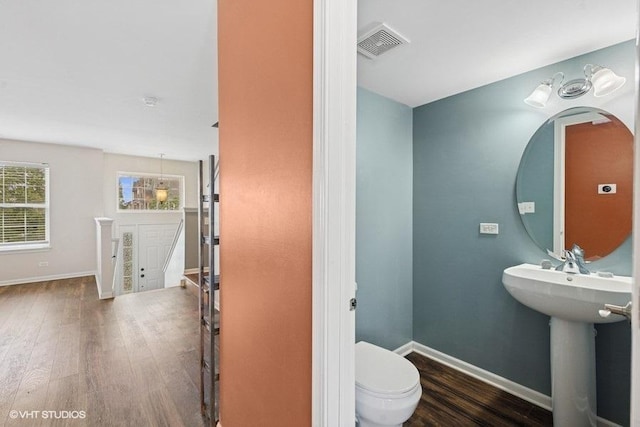 897 Clover Ln, Pingree Grove, IL 60140 - half bath with wood finished floors, toilet, and baseboards