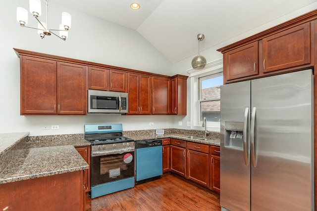 641 E 50th St Unit 3, Chicago, IL 60615 - kitchen featuring stainless steel appliances, a sink, lofted ceiling, dark wood-style floors, and dark stone counters