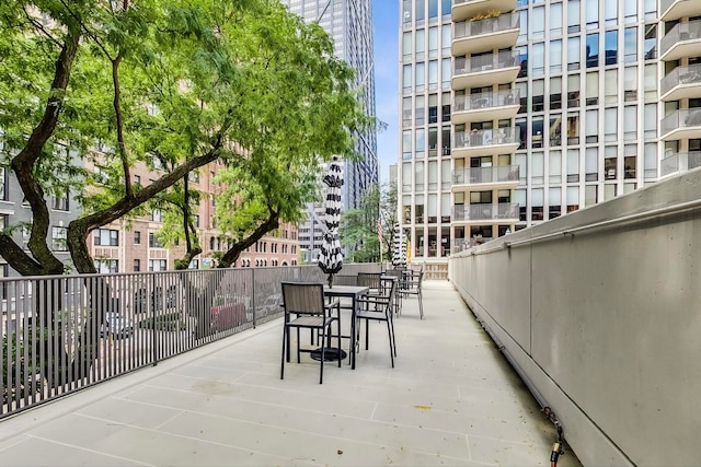 200 E Delaware Pl Unit 18F, Chicago, IL 60611 - view of patio with outdoor dining space and a city view
