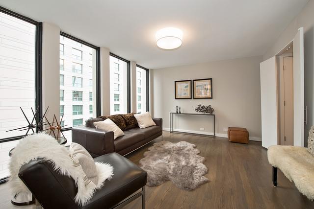 200 E Delaware Pl Unit 18F, Chicago, IL 60611 - living room featuring wood finished floors and baseboards