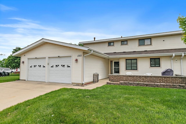 1083 Groton Ct, Schaumburg, IL 60193 - view of front of house featuring a garage, a front lawn, and driveway