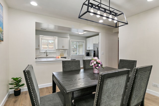 1083 Groton Ct, Schaumburg, IL 60193 - dining space featuring light wood-type flooring, a chandelier, baseboards, and recessed lighting