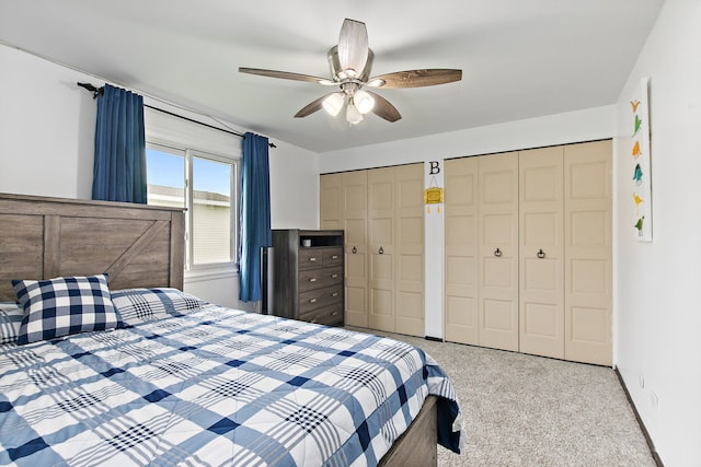 1083 Groton Ct, Schaumburg, IL 60193 - carpeted bedroom featuring multiple closets, a ceiling fan, and baseboards