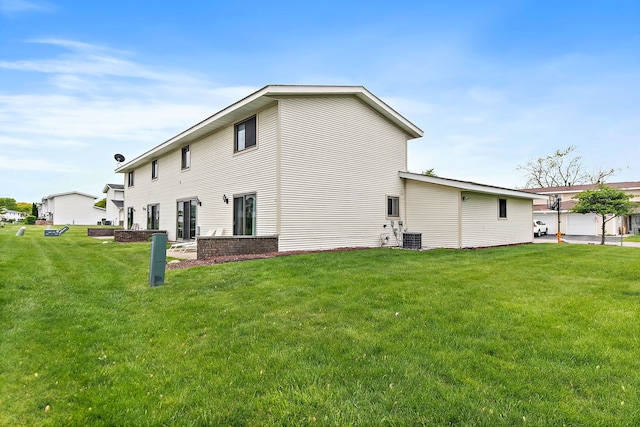 1083 Groton Ct, Schaumburg, IL 60193 - back of property with a lawn and central AC unit