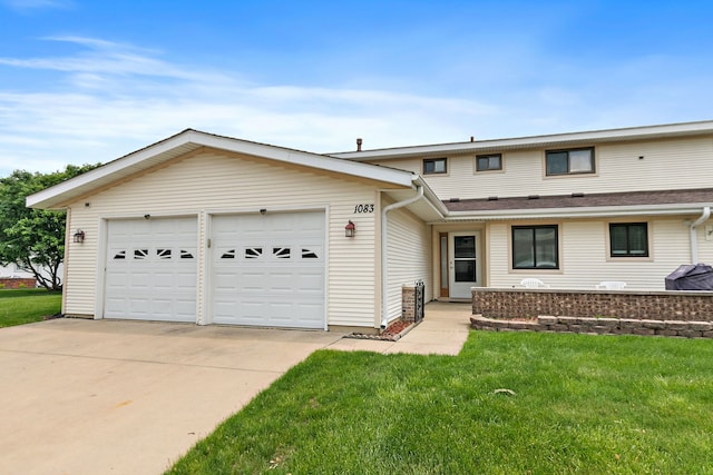 1083 Groton Ct, Schaumburg, IL 60193 - view of front facade featuring driveway, a front lawn, and a garage