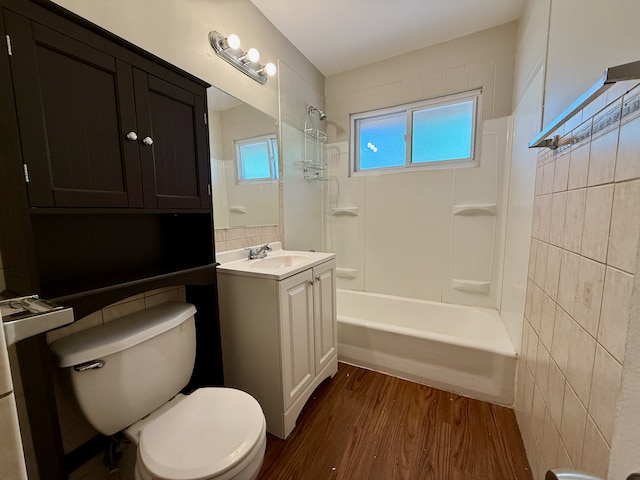15503 Park Ln, South Holland, IL 60473 - full bathroom featuring toilet, vanity, shower / washtub combination, wood finished floors, and tile walls