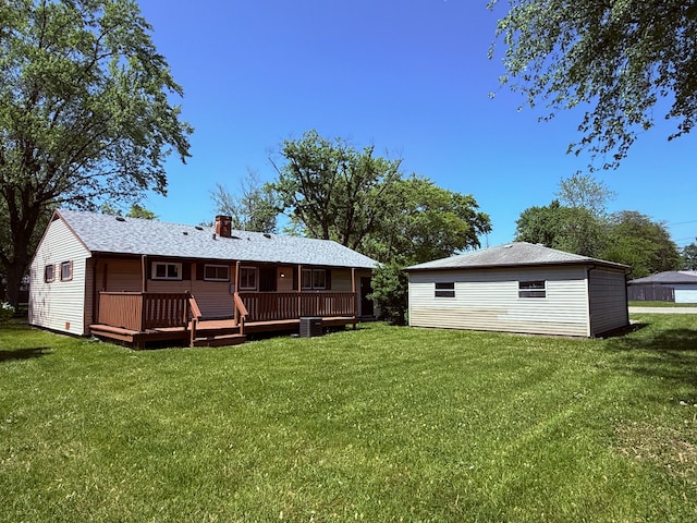 15503 Park Ln, South Holland, IL 60473 - back of property with a deck, a lawn, and a chimney