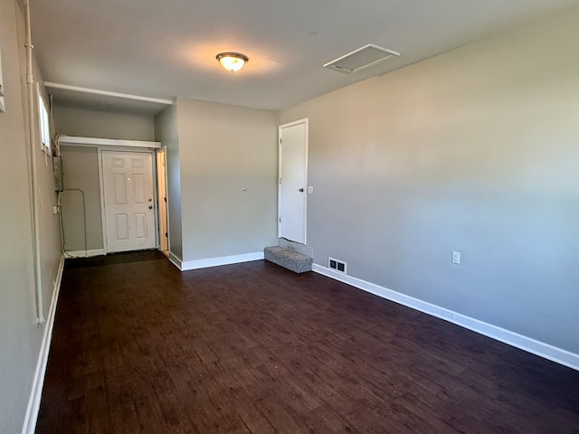15503 Park Ln, South Holland, IL 60473 - empty room with dark wood-style flooring, baseboards, and attic access
