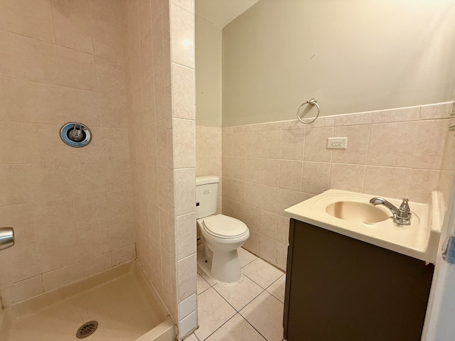 15503 Park Ln, South Holland, IL 60473 - bathroom featuring a shower stall, tile walls, toilet, tile patterned flooring, and vanity