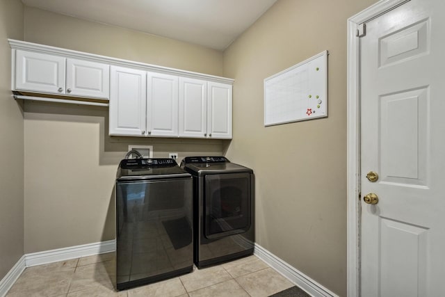 727 Sumac Dr, Aurora, IL 60506 - washroom with washing machine and clothes dryer, cabinet space, baseboards, and light tile patterned flooring