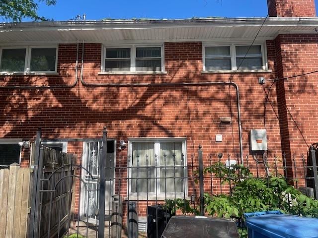 1713 W Thome Ave, Chicago, IL 60660 - view of front of house featuring brick siding and a chimney