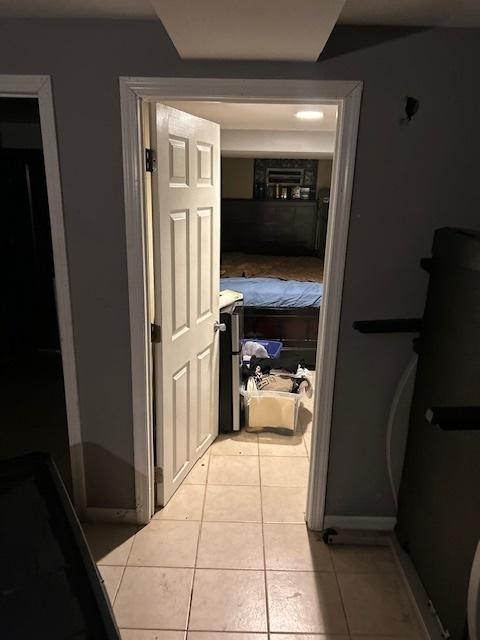 1713 W Thome Ave, Chicago, IL 60660 - hall featuring light tile patterned flooring and baseboards