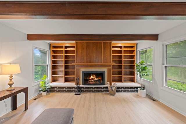 2S644 Devonshire Ln, Glen Ellyn, IL 60137 - unfurnished living room featuring beamed ceiling, baseboards, a fireplace, wood finished floors, and built in features