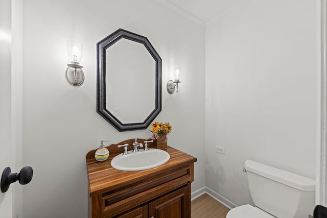2S644 Devonshire Ln, Glen Ellyn, IL 60137 - half bathroom featuring toilet, vanity, wood finished floors, and baseboards