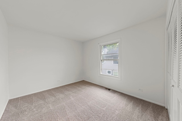 2S644 Devonshire Ln, Glen Ellyn, IL 60137 - unfurnished bedroom with carpet flooring, baseboards, and a closet