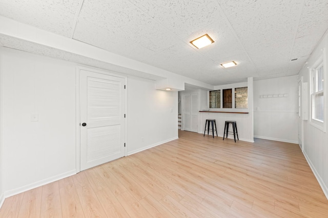 2S644 Devonshire Ln, Glen Ellyn, IL 60137 - basement featuring light wood-style flooring, baseboards, and a drop ceiling