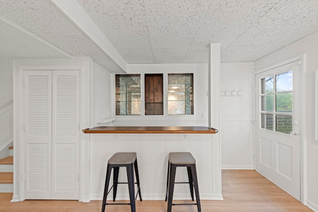 2S644 Devonshire Ln, Glen Ellyn, IL 60137 - kitchen featuring a breakfast bar and light wood-style floors