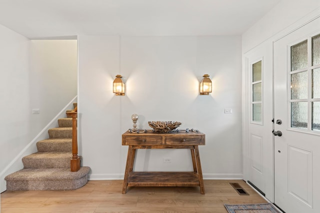 2S644 Devonshire Ln, Glen Ellyn, IL 60137 - foyer entrance with light wood finished floors, stairway, and baseboards