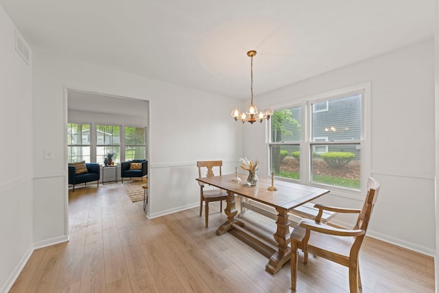 2S644 Devonshire Ln, Glen Ellyn, IL 60137 - dining space with light wood finished floors, a chandelier, and baseboards