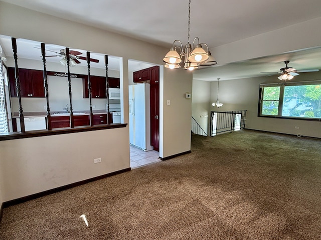 19828 Monterey Ave, Lynwood, IL 60411 - spare room with light colored carpet, a ceiling fan, a chandelier, and baseboards