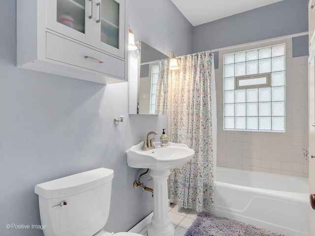 11 S Catherine Ave, La Grange, IL 60525 - bathroom featuring toilet, shower / bath combo with shower curtain, and tile patterned floors